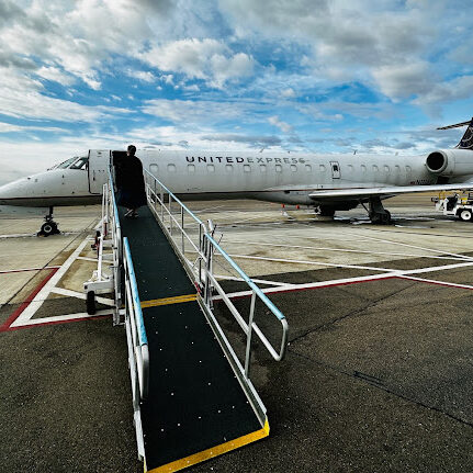 small commercial plane with jetbridge